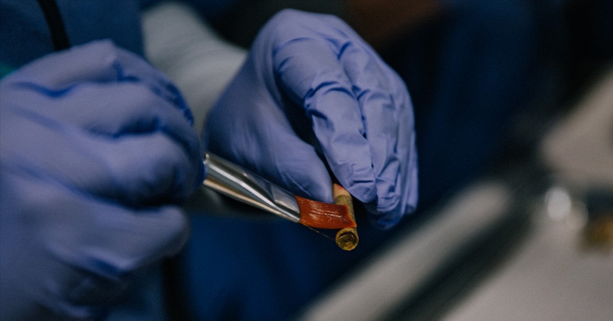 Using a simple solution to glue the wrap into the glass tip. 